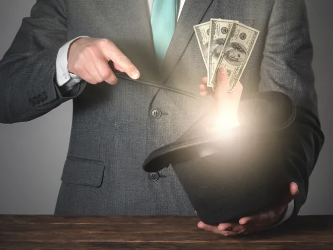 magician conjuring money